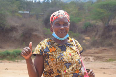 Anna from Kee SHG with their sand dam road crossing